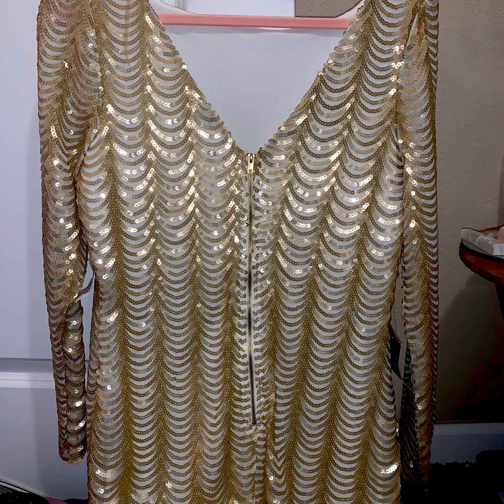 Knee length dress gold and white.